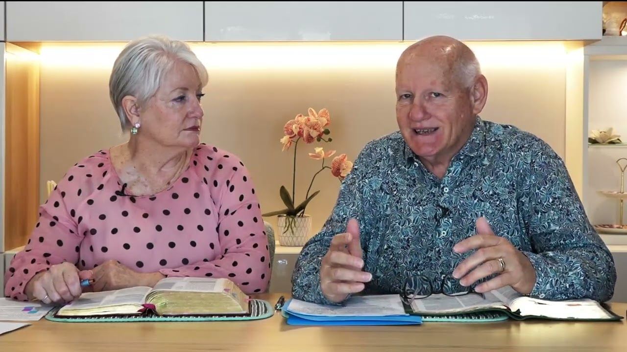 Shayne and Susan Cunningham at a table with their Bibles open during Victory Bible Studies