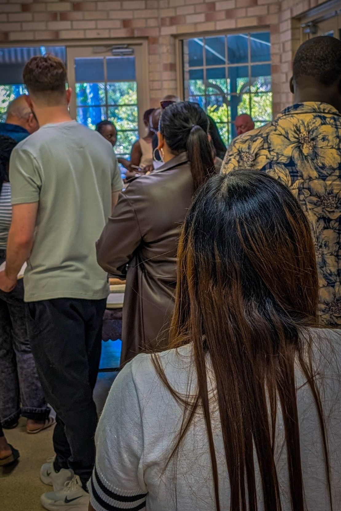People of many backgrounds gathered together in the hall at CoastWIDE Church in Arundel, Gold Coast